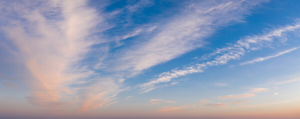 Colorful sky with cirrus clouds during dawn. High resolution panorama. View from drone