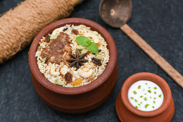 beef or Mutton or lamb biryani. Spicy Indian Malabar biryani or Hydrabadi biryani, Dum Biriyani,  fish and rice. pulao basmati rice, spicy mixed rice dish with meat curry for Ramadan Kareem, Eid