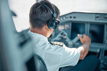 Young pilot taking off modern passenger plane