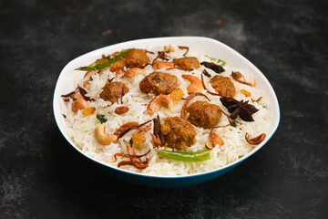 Veg biryani or soya biryani. Spicy Indian Malabar biryani or Hydrabadi biryani, Dum Biriyani, pulao, pulav, pilaf, basmati rice, spicy mixed rice dish with meat curry for Ramadan Kareem, Eid