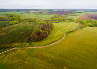 Panoramic view of meadows and Fields of Central Russia on may gloomy day