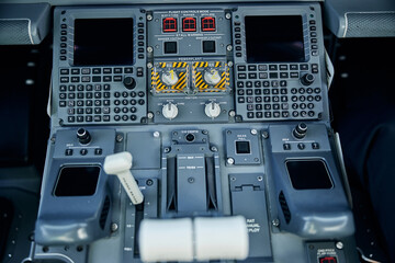 Panel with switchers inside pilot cockpit in jet