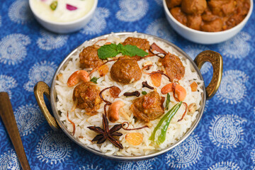 Veg biryani or soya biryani. Spicy Indian Malabar biryani or Hydrabadi biryani, Dum Biriyani, pulao, pulav, pilaf, basmati rice, spicy mixed rice dish with meat curry for Ramadan Kareem, Eid