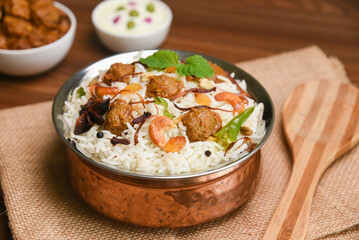 Veg biryani or soya biryani. Spicy Indian Malabar biryani or Hydrabadi biryani, Dum Biriyani, pulao, pulav, pilaf, basmati rice, spicy mixed rice dish with meat curry for Ramadan Kareem, Eid
