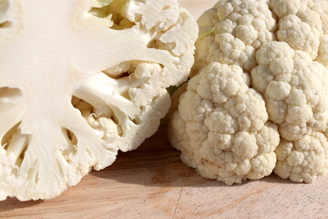 Cauliflower on wooden chopping board