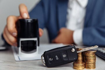 Close up shots hands of client stamping car rental form.