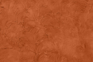 Saturated dark orange brown colored low contrast Concrete textured background with roughness and...