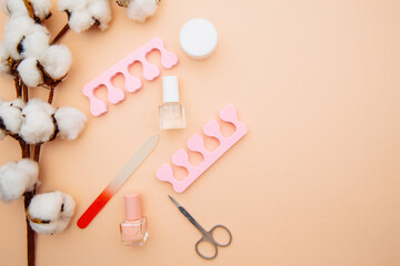 Beauty concept. A set of professional tools for manicure and pedicure on pink table.