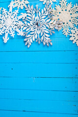 Christmas. Snowflakes on a wooden background.