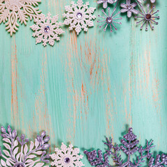 Christmas. Snowflakes on a wooden background. Frame.