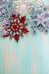 Christmas. Snowflakes on a wooden background.