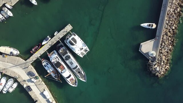 Aerial view of the pier with Paros island on a background Naousa village