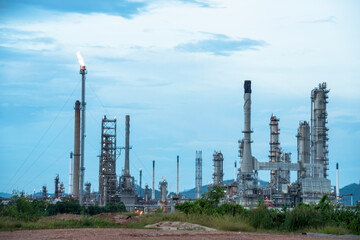Fototapeta premium Oil refinery gas petrol plant industry with crude tank, gasoline supply and chemical factory. Petroleum barrel fuel heavy industry oil refinery manufacturing factory plant. Refinery industry concept
