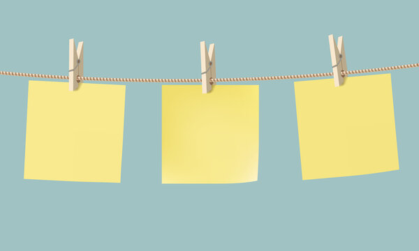 Yellow Paper Stickers Hang On A Rope With A Clothespin