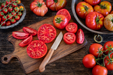 Large variety of tomatoes on the table.
