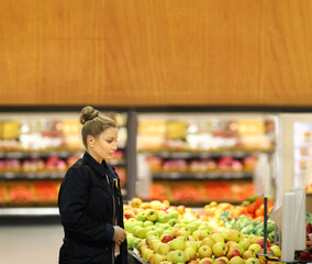 Woman buying fruits at the market
