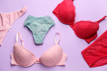 Stylish female underwear on color background
