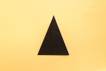 Fototapeta premium Step by step photo instruction how to make origami paper hat. Halloween hat of witch. Simple diy with kids children's concept.