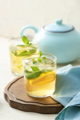 Glasses of tasty cold ice tea on table