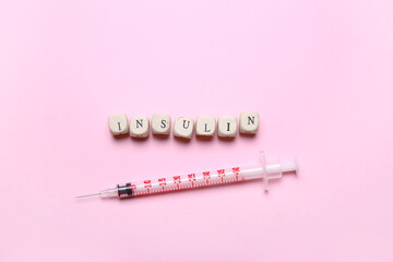 Syringe for insulin injection on color background. Diabetes concept