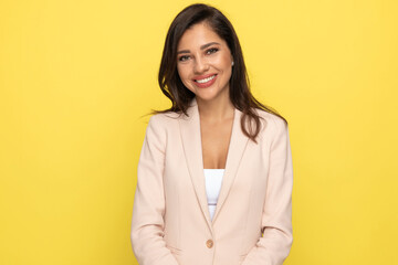 Obraz premium sexy young businesswoman in pink suit smiling
