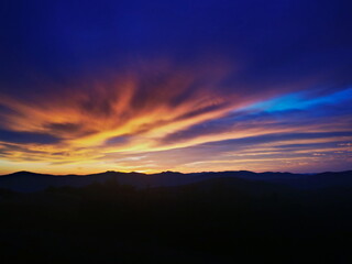 Red sunrise at the top of the mountain. Sunrise in the Bieszczady mountains Carpathians. Outline of the mountains.