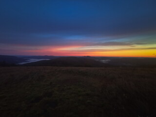 Red sunrise at the top of the mountain. Sunrise in the Bieszczady mountains Carpathians. Outline of the mountains.