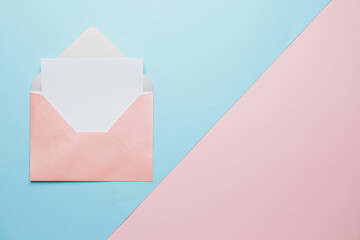 Blank card and envelope on color background