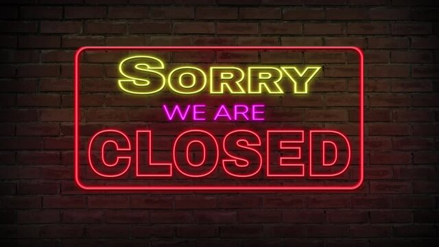 Sorry we are closed neon sign blinking on brick wall background, Business  concept.
