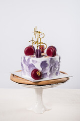 Birthday cake with macaroons aniversary concept with copy space .