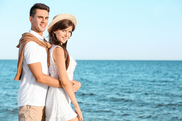 Happy young couple on sea beach