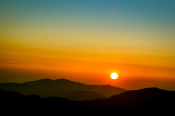 Sunrise over the mountains. Early morning scenic view of Sandakphu (3665 m; 11,930 ft) is the highest point of the Singalila Ridge in Nepal on the West Bengal-Nepal border	