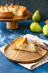 Plate with tasty pear cake on table