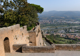 Fototapeta na wymiar View of the valley from the fortress wall with tower of Orvieto in Umbria, Italy
