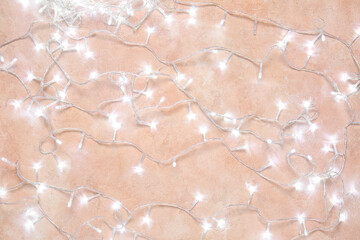 Christmas lights on color background