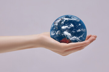 Planet Earth in palm of your hand. Concern for the environment and ecology. Elements of this image are furnished by NASA