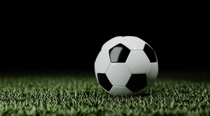 Fototapeta premium Soccer ball on the lawn of a soccer field, isolated on black background