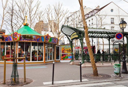 PARIS, FRANCE - MARCH 5: Abbesses station on Paris Metro in Montmartre. Station entrance is one of only two original glass covered Guimard entrances, called edicules in Paris, France on March 5, 2013