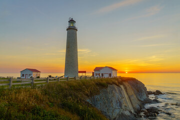 Fototapeta na wymiar Sunrise in the Cap-des-Rosiers Lighthouse
