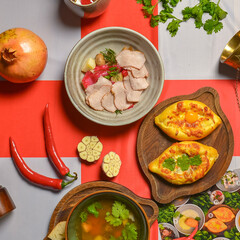 Traditional Georgian food on a National Georgia flag background. Top view, flat lay concept, menu concept.