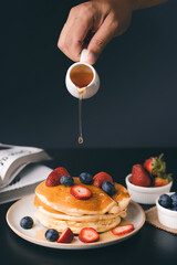 Sweet Homemade Stack of Pancakes with Butter and Syrup for Breakfast

