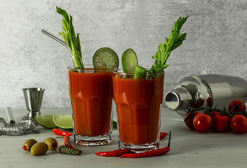 Bloody Mary Cocktail in glasses with garnishes.