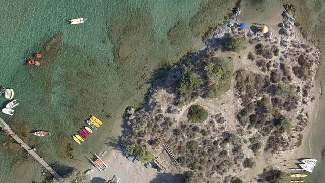 Aerial drone video of sandy beach blue sea water, clear blue sky Paros island Cyclades, Greece