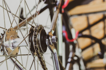 Cassette and chain part of old bicycle close up and vintage style photo.