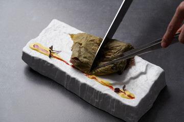 Fish-stuffed grape leaves. Fish Dolma - Lebanese cuisine