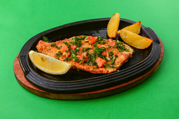 Grilled beef steak with fries,baked potatoes. Home made food or food in restaurant. Concept for a tasty meal.