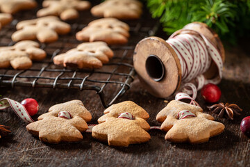 Closeup of making gingerbread cookies chain for Christmas tree