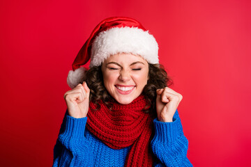 Close-up portrait of her she nice attractive lovely cheerful cheery overjoyed lucky girl wearing festal cap celebrating having fun isolated bright vivid shine vibrant red color background