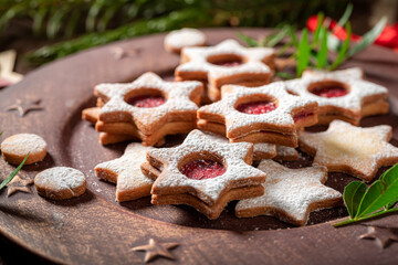 Handmade stained glass cookies with Christmas ornaments and mistletoe