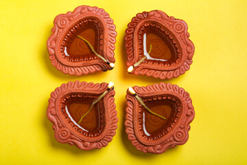 happy diwali or happy deepavali greeting card made using a photograph of diya or oil lamp